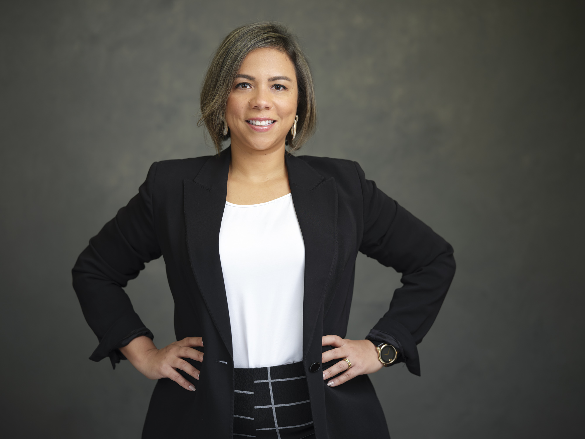 woman standing with hands on hips in business casual wear for corporate professional headshot singapore taken by coco creative studio