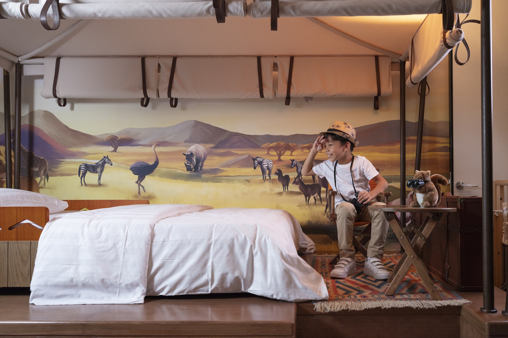 Young boy in safari themed hotel room Singapore in lifestyle photography