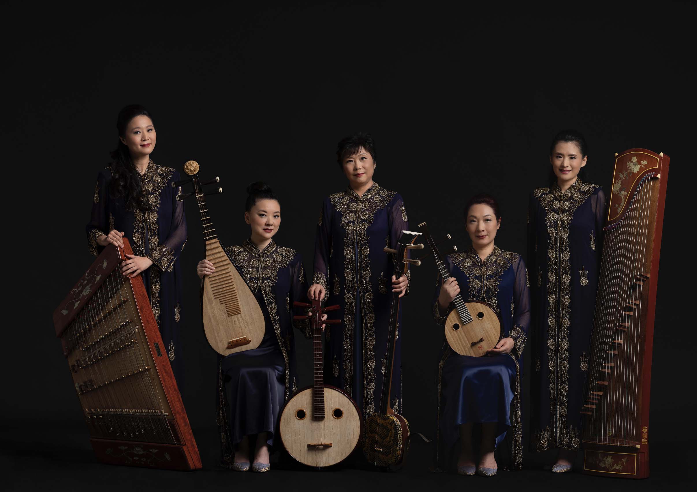singapore chinese orchestra in traditional costumes and instruments group portrait
