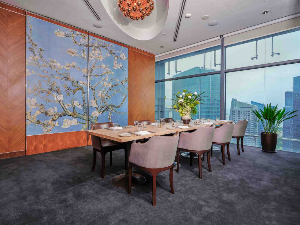 Private room in Artemis Restaurant with beautiful blue painting and long table