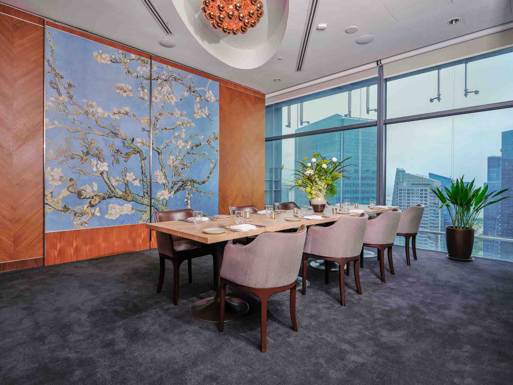 Private room in Artemis Restaurant with beautiful blue painting and long table