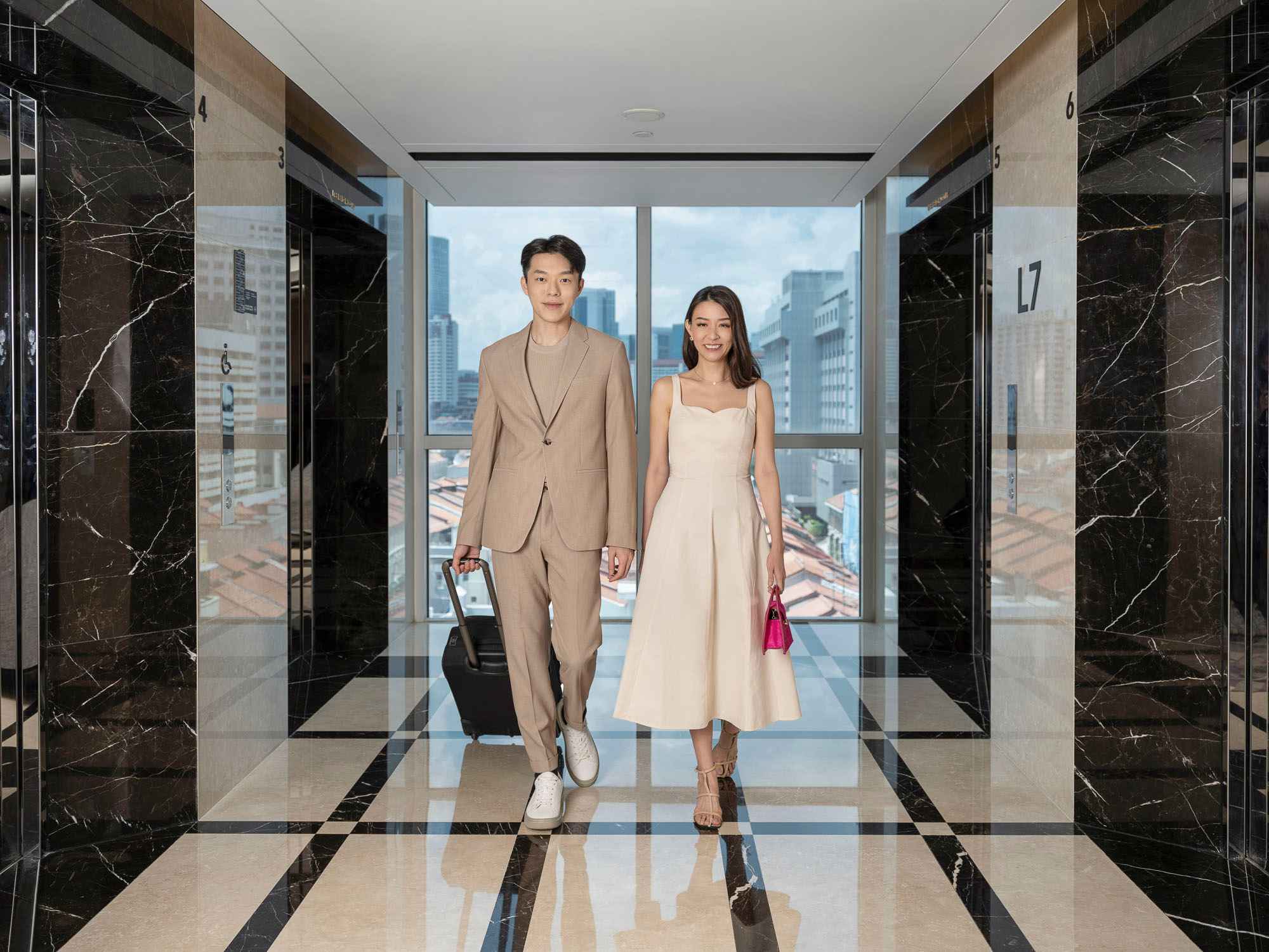 Couple checking into hotel at Orchid Hotel, photo taken by coco creative studio lifestyle shoot