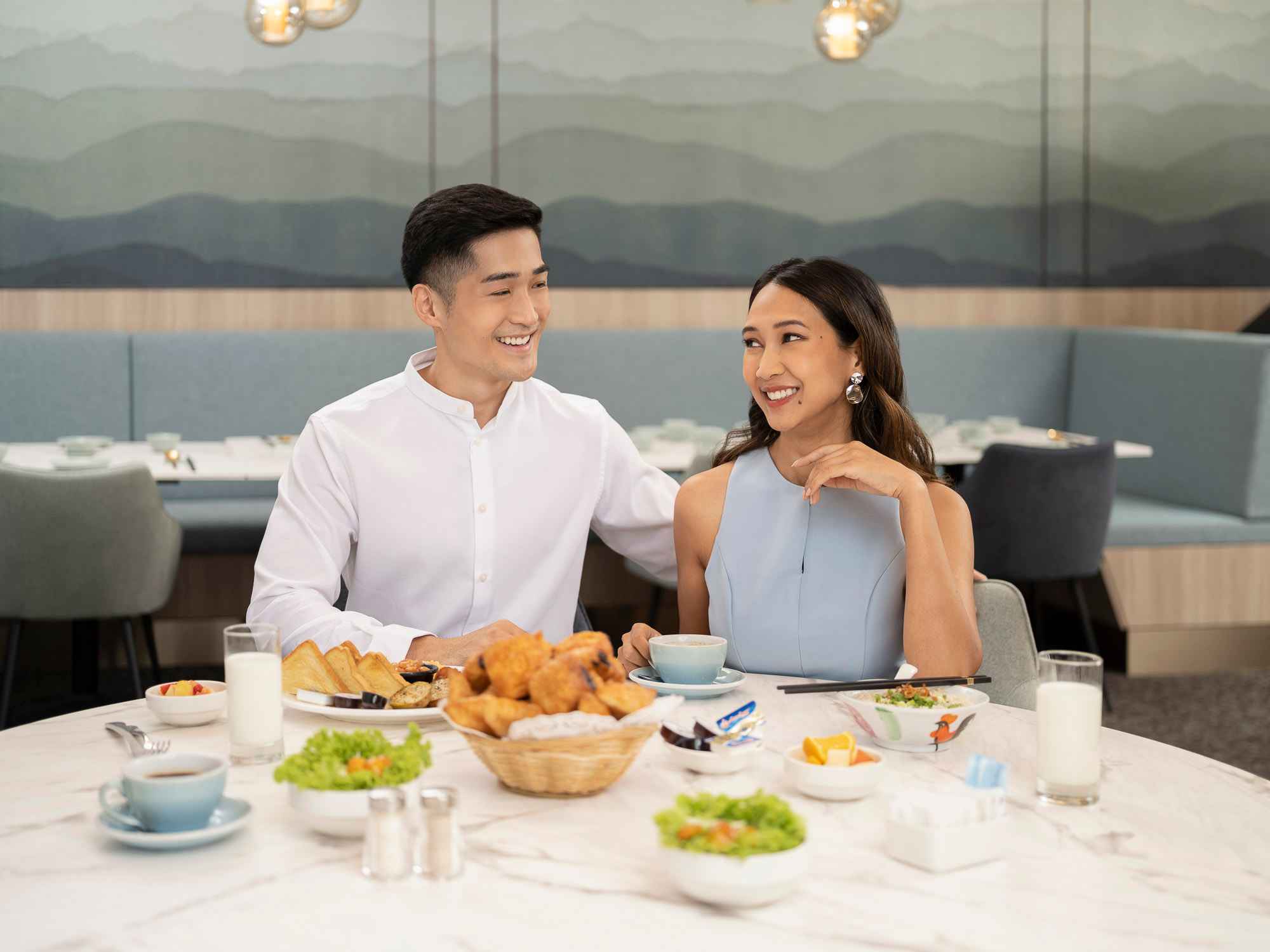Couple enjoying a meal at Orchid Hotel, photo taken by coco creative studio lifestyle shoot