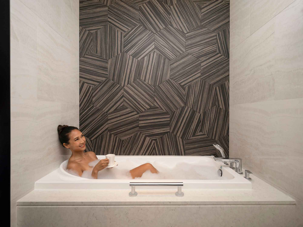 Lady having a bubble bath at Orchid hotel,, photo taken by coco creative studio lifestyle shoot-Orchid-lifestyle-interior-hospitality-photgraphy-coco-creative-studio-singapore-france
