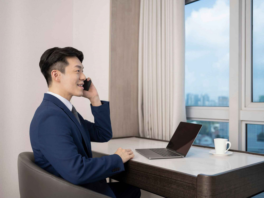 Male working in the guestroom of orchid hotel, photo taken by coco creative studio lifestyle shoot-Orchid-lifestyle-interior-hospitality-photgraphy-coco-creative-studio-singapore-france