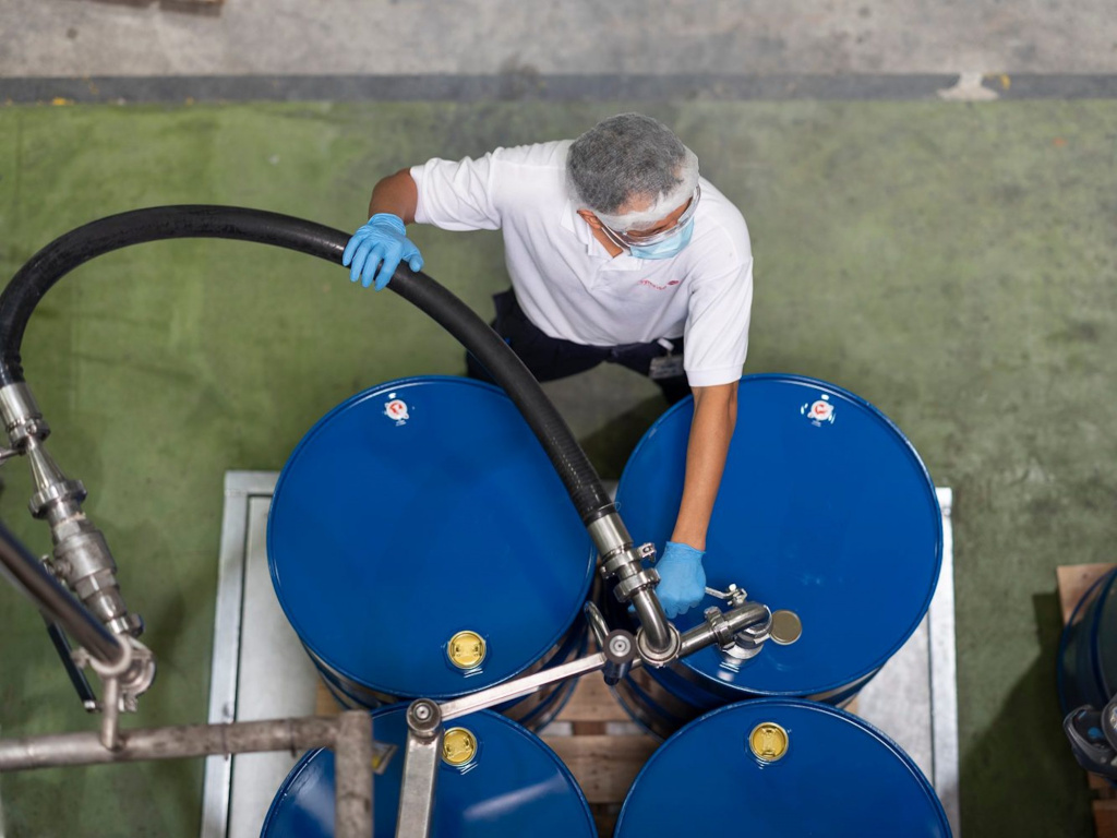 Symrise staff filling up tanks, photo taken by coco creative studio industrial photography