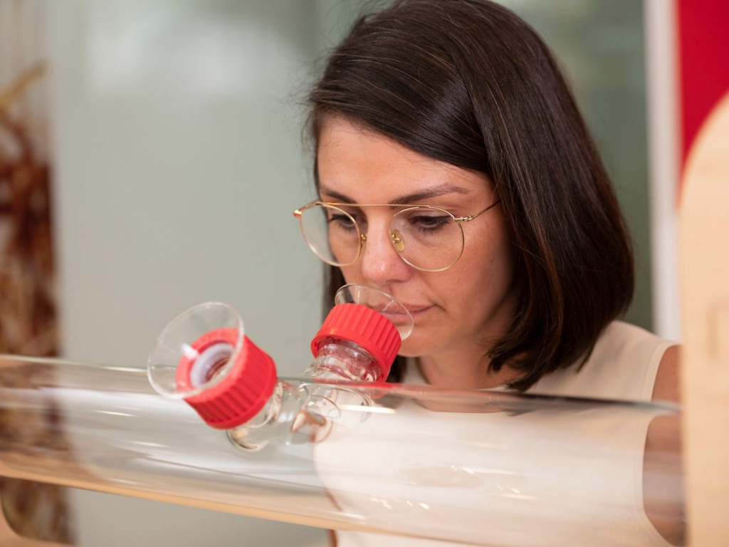 Lady smelling through glass, photo taken by coco creative studio industrial photography