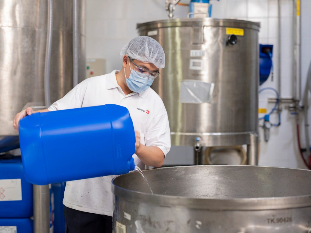 Symrise staff filling up tanks, photo taken by coco creative studio industrial photography
