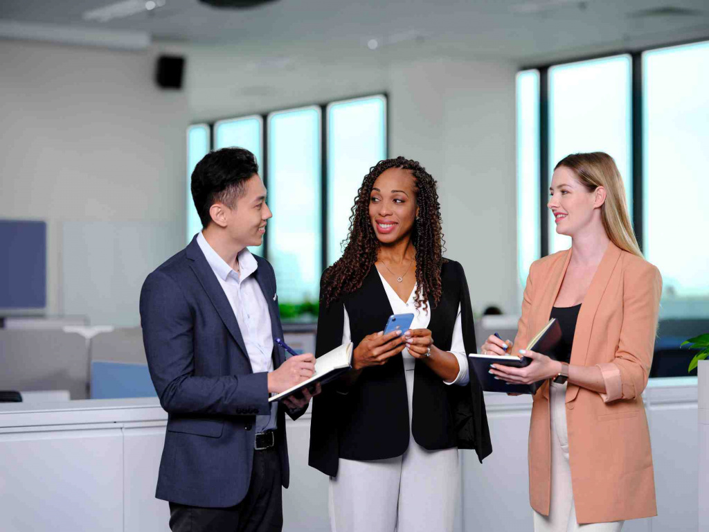 WSA staff having a meeting standing, photo taken by coco creative studio commercial photography