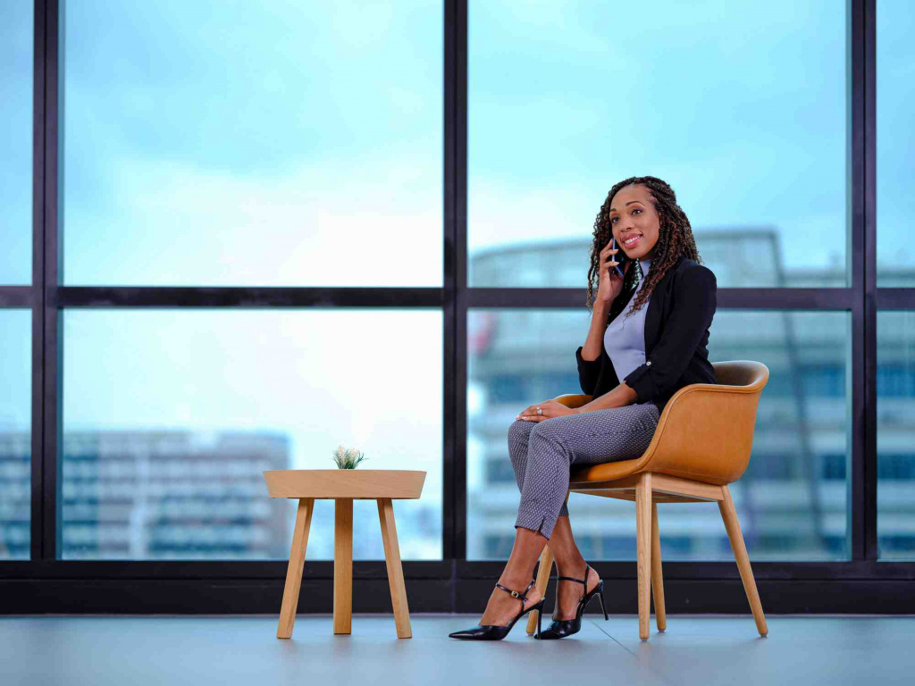 WSA staff seating on a chair on the phone, photo taken by coco creative studio commercial photography