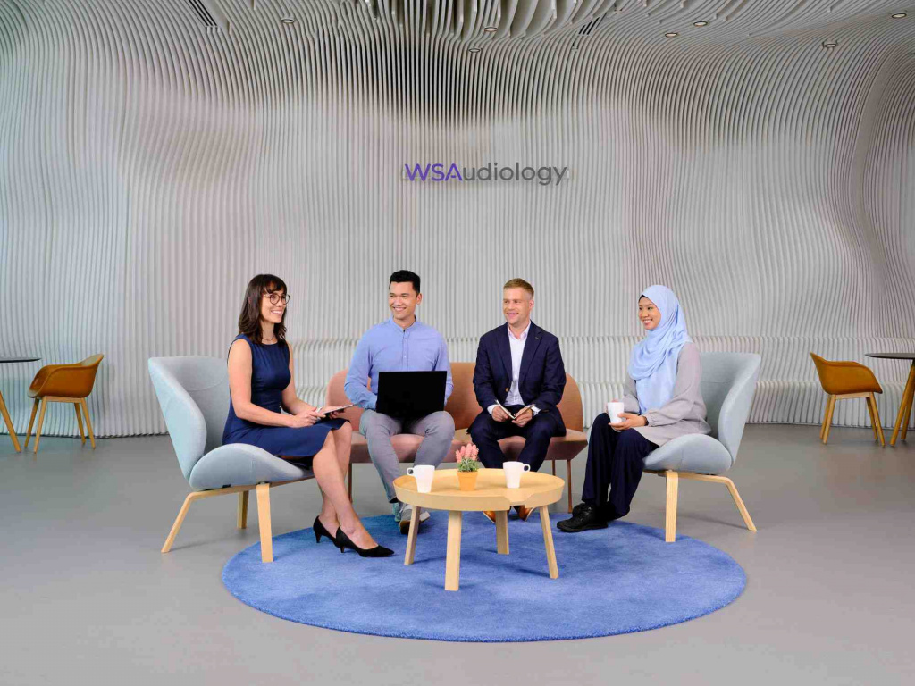 4 WSA colleagues having a meeting in the lobby, photo taken by coco creative studio commercial photography