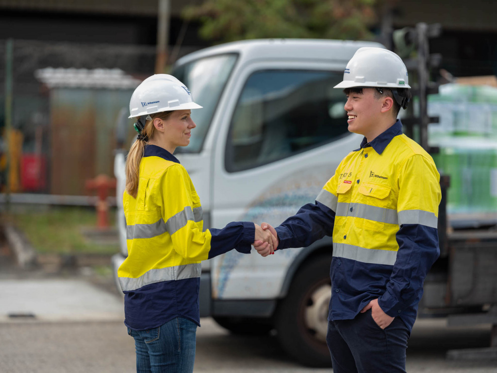 Wihelmson Industrial Photography - 2 partners handshaking