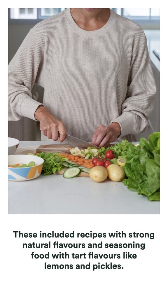 A woman with cancer prepares a meal with vegetables