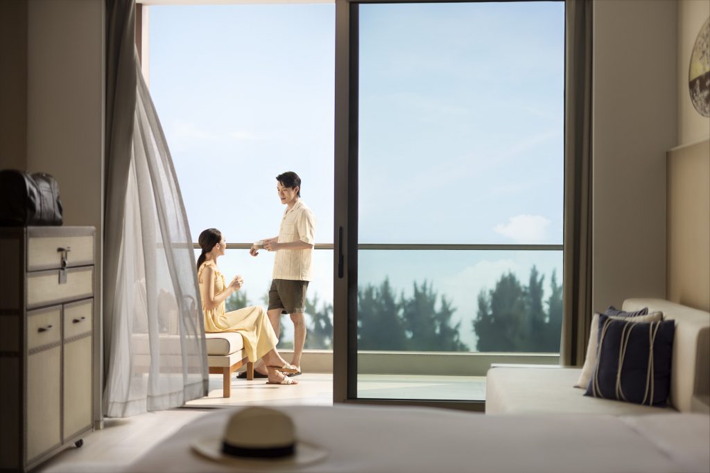Hotel resort lifestyle photographer Hilton China Asia commercial - Couple on the balcony in an hotel room, watching the view