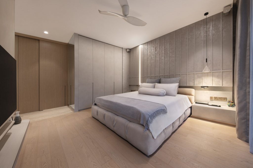 Interior photo of a large bedroom with a double bed and parquet flooring