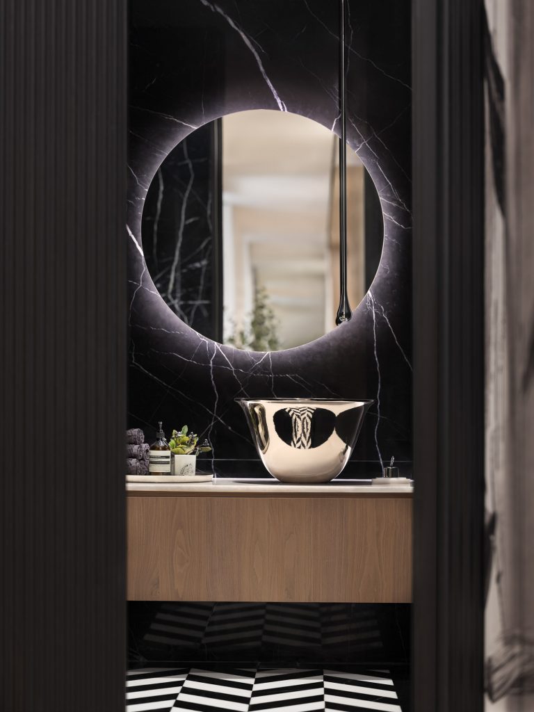 Interior photo of toilet painted all black with tiled floor