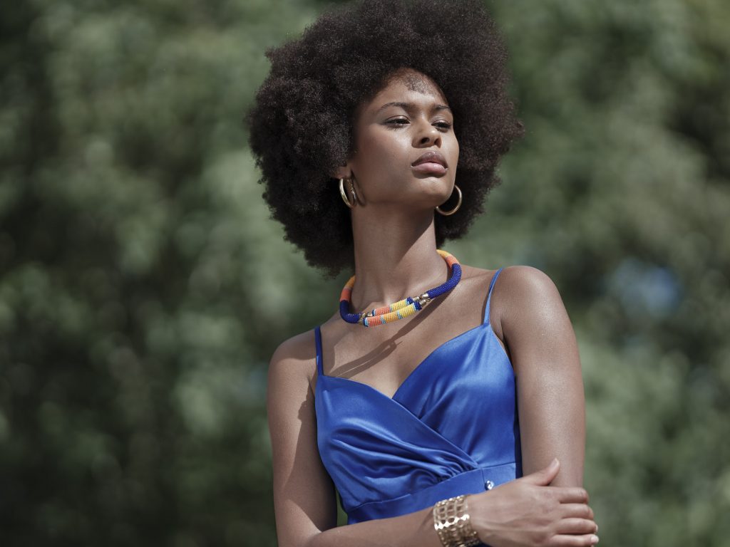 photo portrait in brittany in the fields. The model is wearing a blue dress
