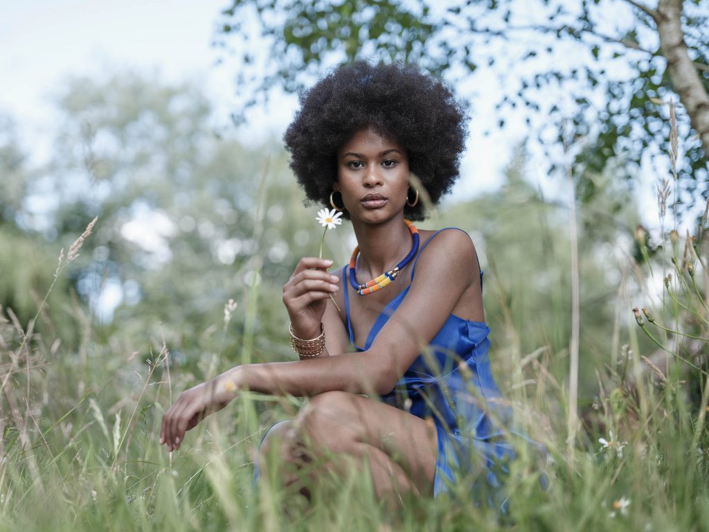 photo portrait in brittany in the fields. The model is wearing a blue dress
