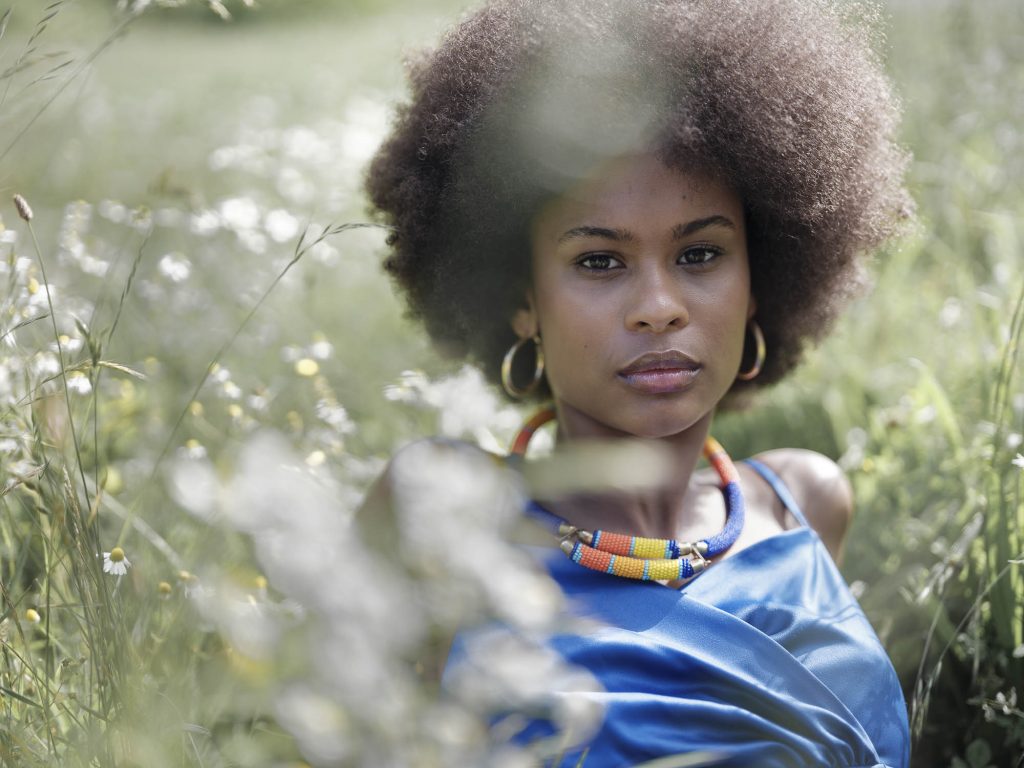 photo portrait in brittany in the fields. The model is wearing a blue dress