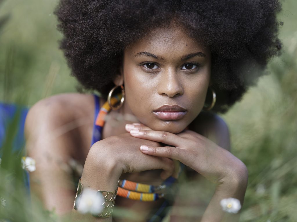 photo portrait in brittany in the fields. The model is wearing a blue dress